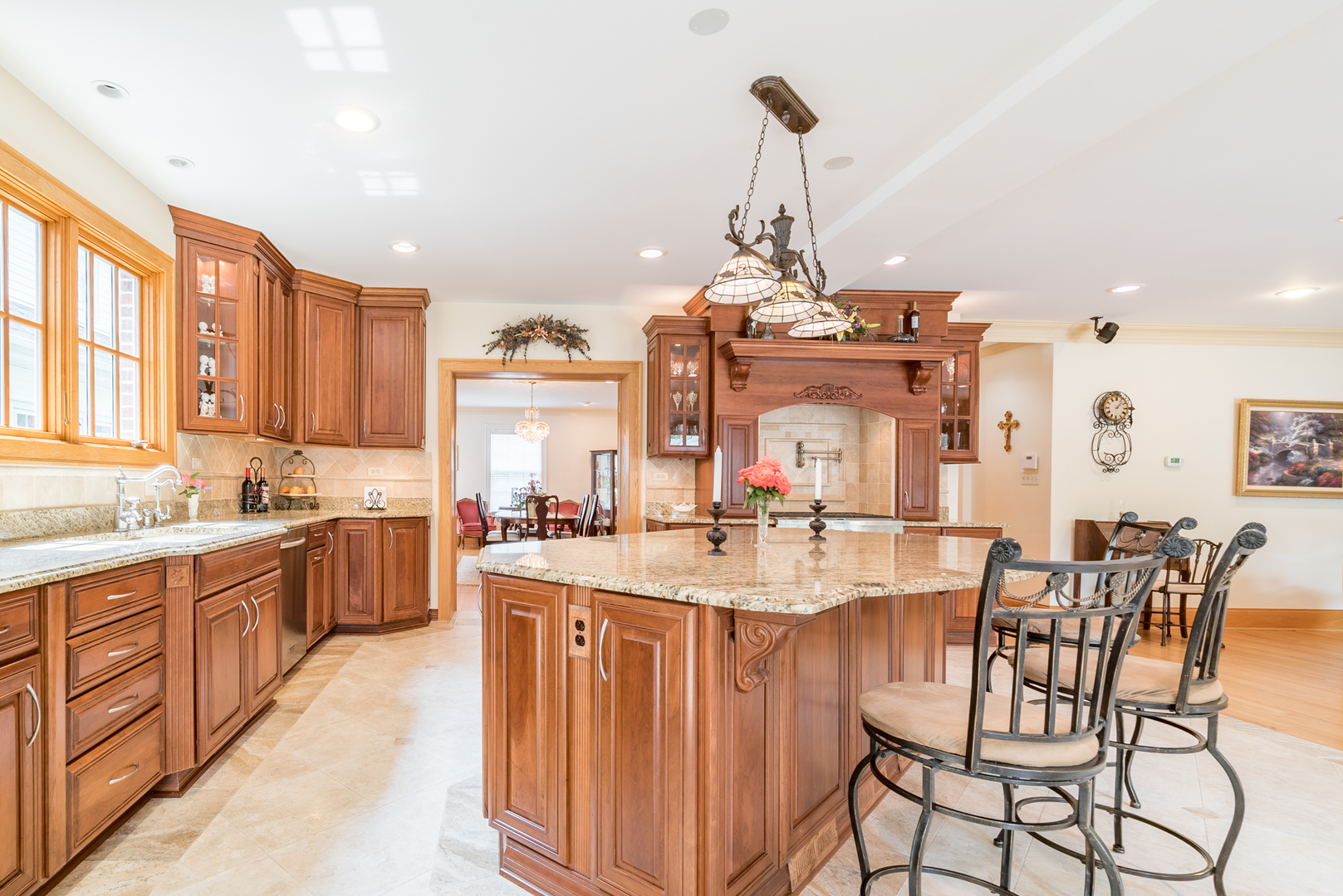 117 Elmore Street Park Ridge, IL 60068 - Photo 7 of 31 a view of a kitchen with kitchen island stainless steel appliances a table and chairs in it