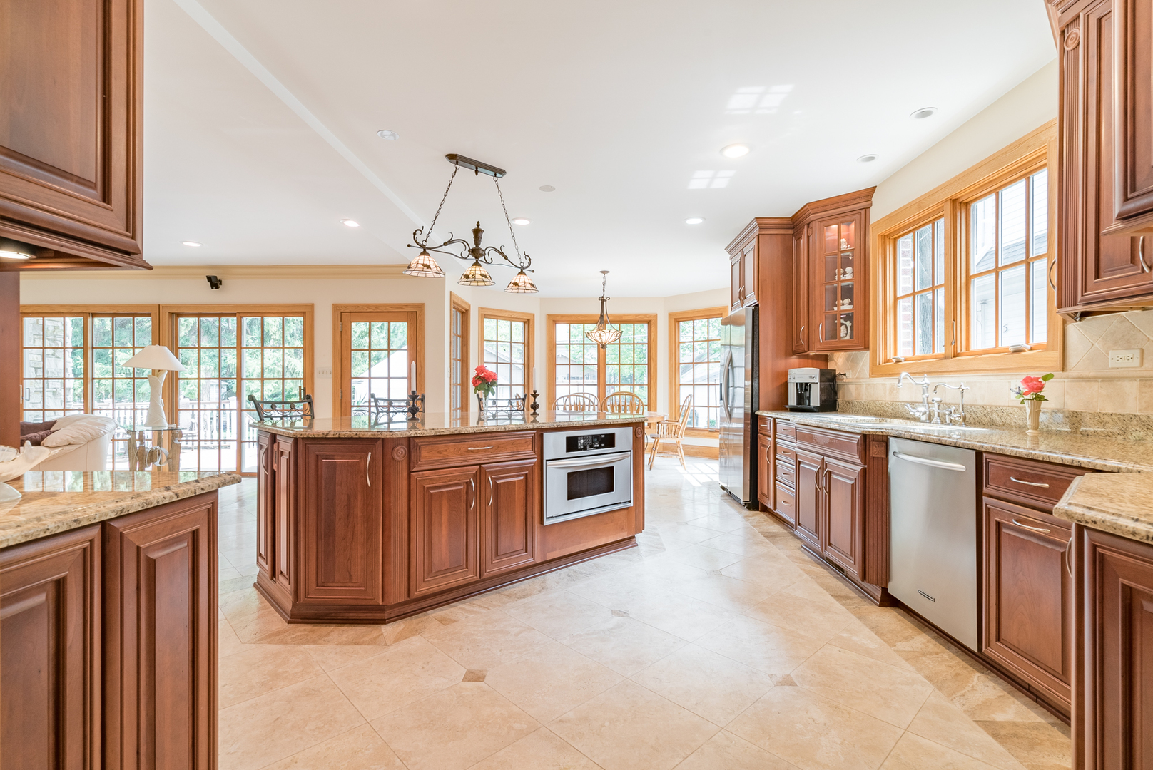 117 Elmore Street Park Ridge, IL 60068 - Photo 8 of 31 a large kitchen with stainless steel appliances granite countertop a large window and a counter space