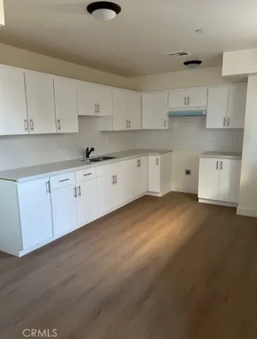 an empty room with wooden floor