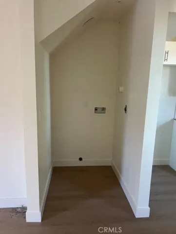 a large white kitchen with white cabinets