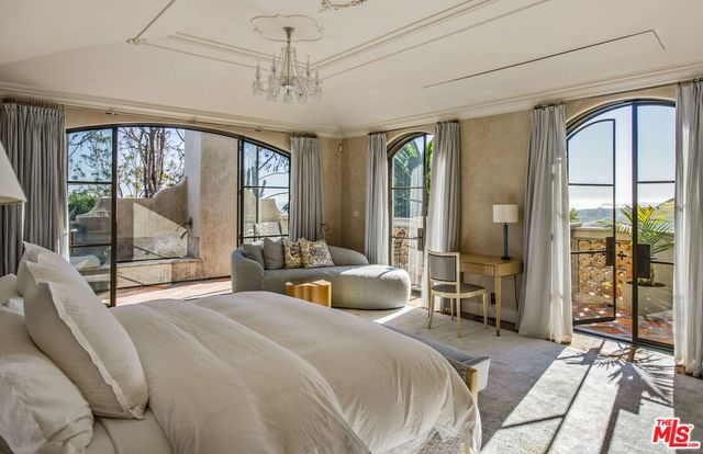 a bathroom with a granite countertop sink a mirror and a shower