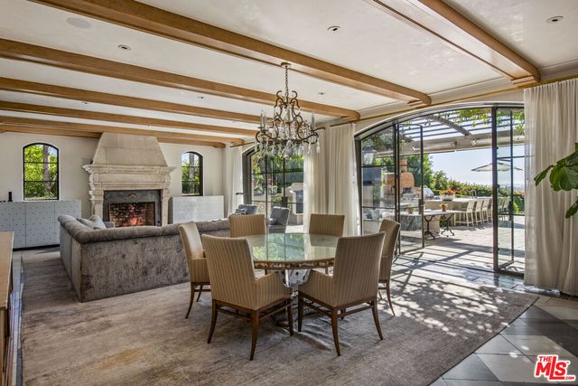 a view of kitchen with furniture and refrigerator