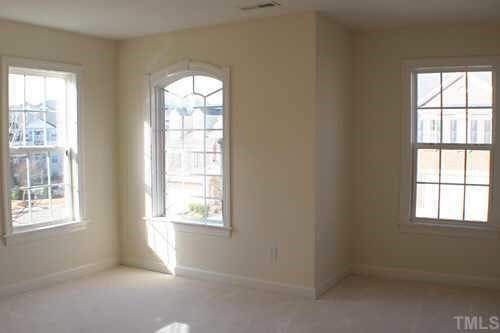 7220 Summit Waters Lane Raleigh, NC 27613 - Photo 5 of 11 an empty room with windows
