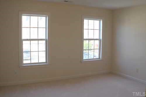 7220 Summit Waters Lane Raleigh, NC 27613 - Photo 9 of 11 an empty room with a window