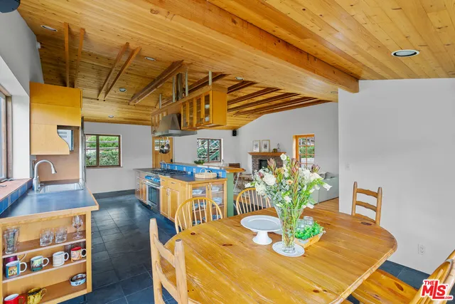 a bed sitting in a room next to a window