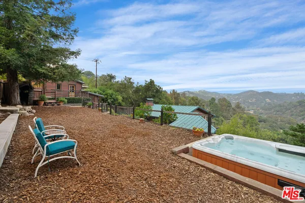 a view of a yard with an outdoor space