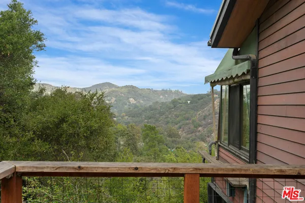a view of a house with a mountain