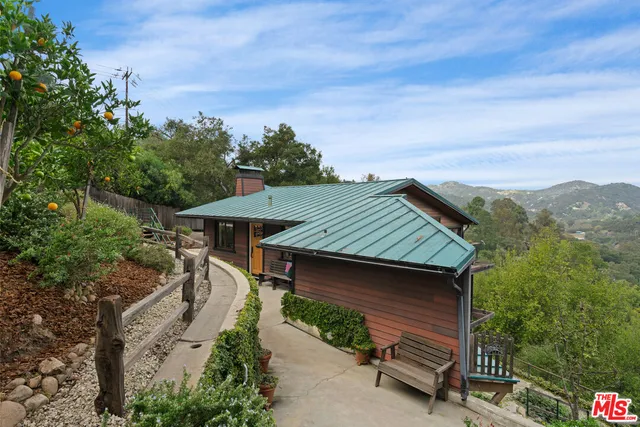 a view of a city with lush green forest