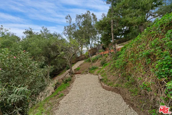 an aerial view of a house with outdoor space and street view