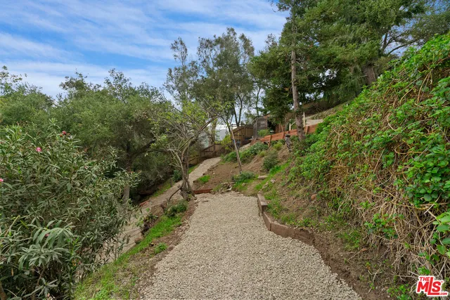 an aerial view of a house with outdoor space and street view