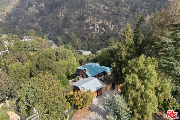a aerial view of a house with a yard