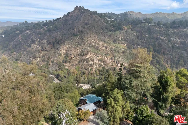 an aerial view of city with green space