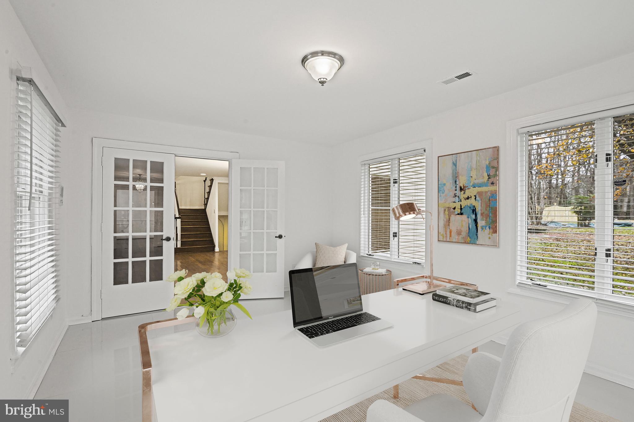 355 Springvale Road Great Falls, VA 22066 - Photo 16 of 37 a living room with furniture and floor to ceiling windows