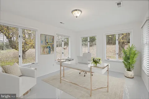 a living room with furniture and windows