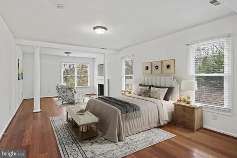 a bedroom with a large bed and a window