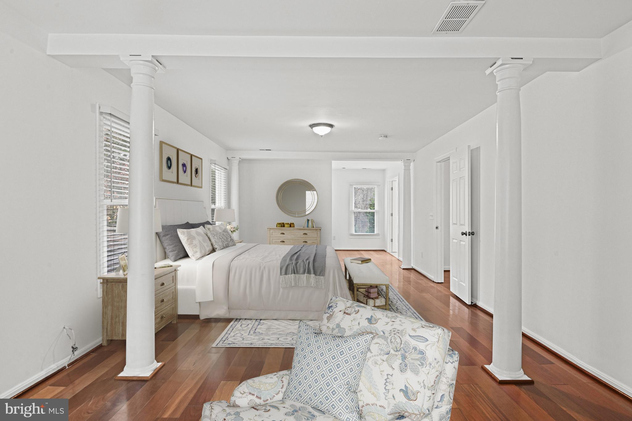 355 Springvale Road Great Falls, VA 22066 - Photo 20 of 37 a bedroom with a bed and wooden floor