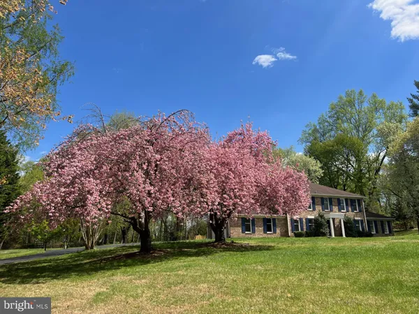 a view of a building with a yard