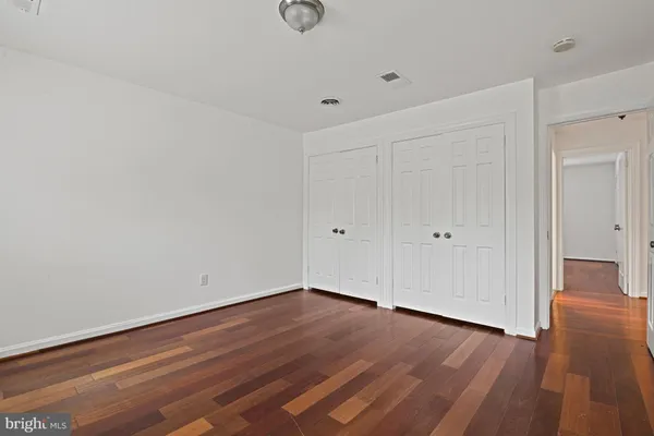 a view of room with wooden floor