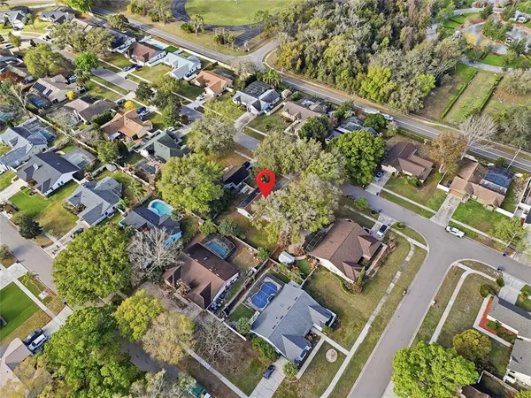 an aerial view of residential houses with outdoor space