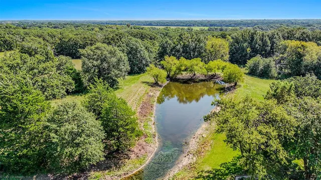 a view of balcony with wooden floor and fence