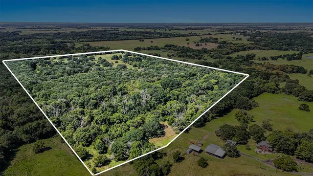 a view of a kitchen with a sink and a refrigerator