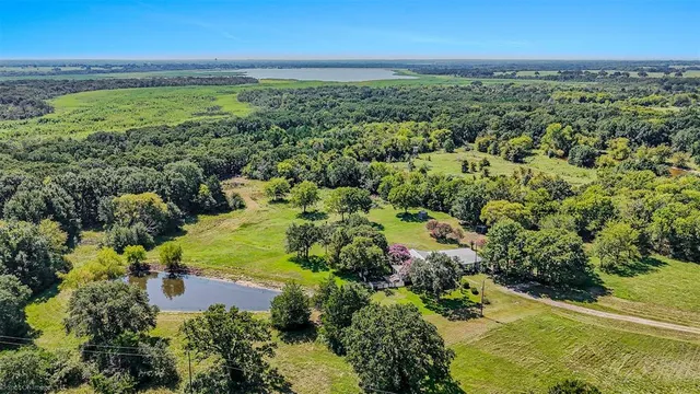 a kitchen with stainless steel appliances granite countertop a refrigerator and a stove
