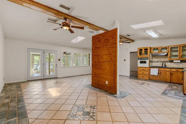 a view of an empty room with a window