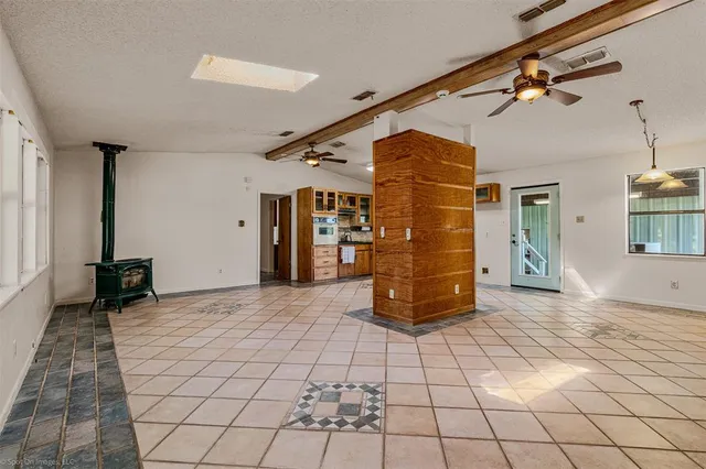 a bathroom with a sink a mirror and shower