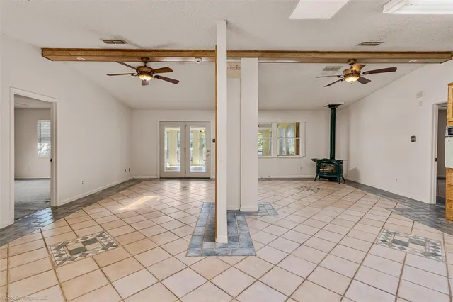 a backyard of a house with lots of green space and a fountain