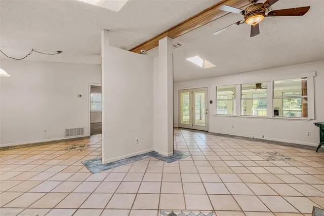 a couple of chairs sitting in backyard of a house