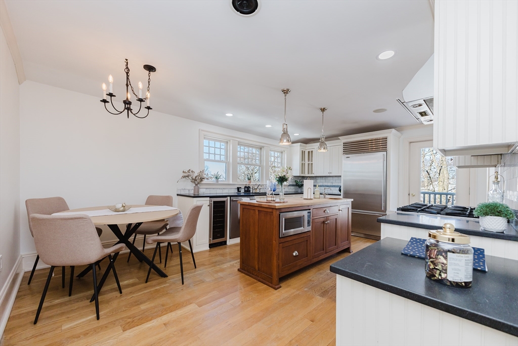 a kitchen with sink cabinets and wooden floor