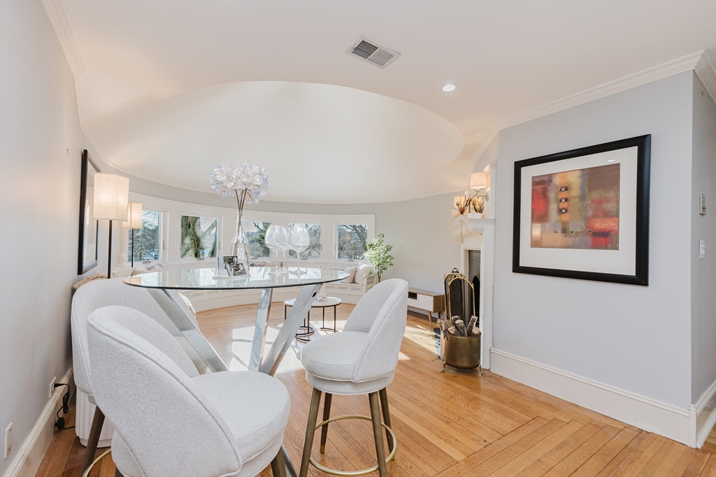 159 Washington Street, Unit 4 Newton, MA 02458 - Photo 12 of 41 a view of a dining room with furniture and wooden floor