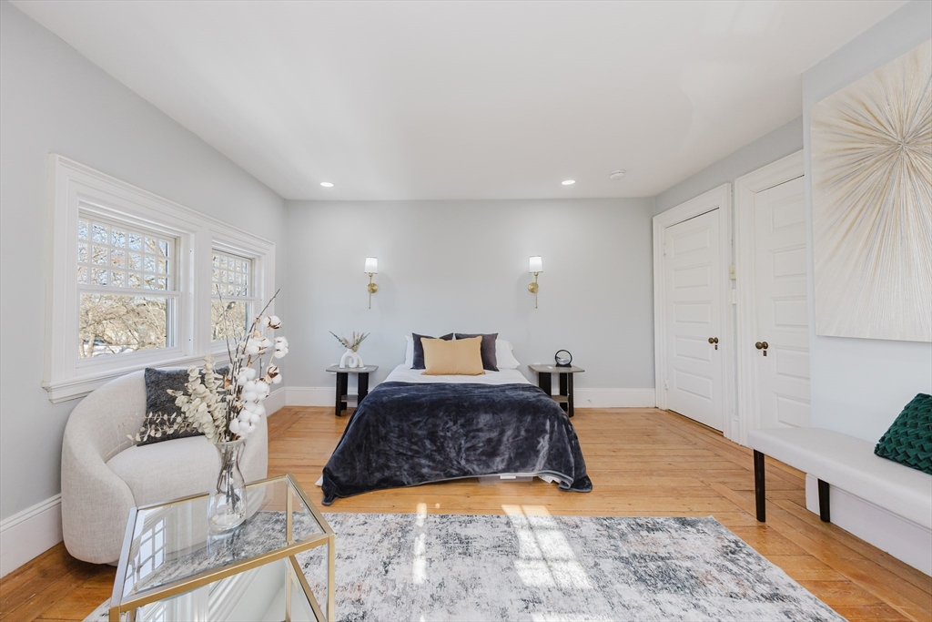 159 Washington Street, Unit 4 Newton, MA 02458 - Photo 14 of 41 a bed room with furniture and a rug