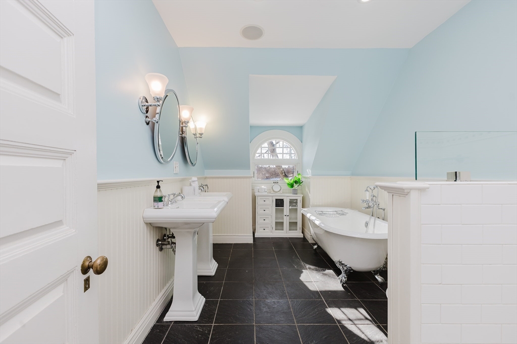 159 Washington Street, Unit 4 Newton, MA 02458 - Photo 18 of 41 a bathroom with a sink toilet and tub