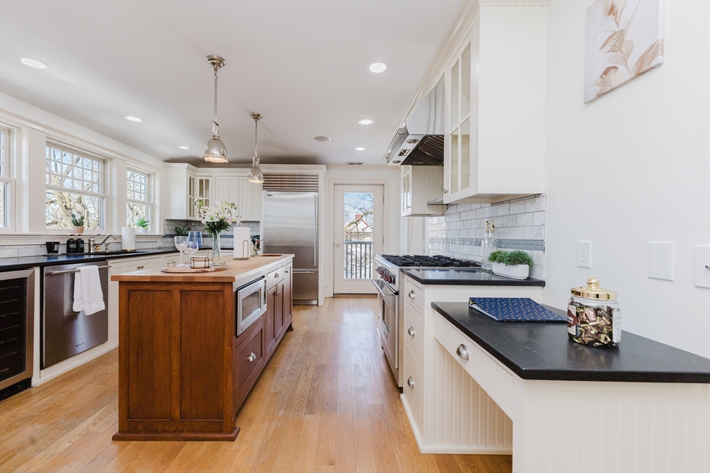 159 Washington Street, Unit 4 Newton, MA 02458 - Photo 2 of 41 a kitchen with a sink stove a sink and cabinets