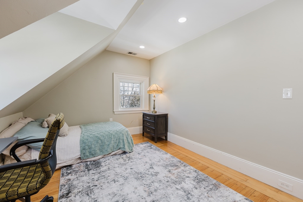 159 Washington Street, Unit 4 Newton, MA 02458 - Photo 26 of 41 a bedroom with furniture and a window
