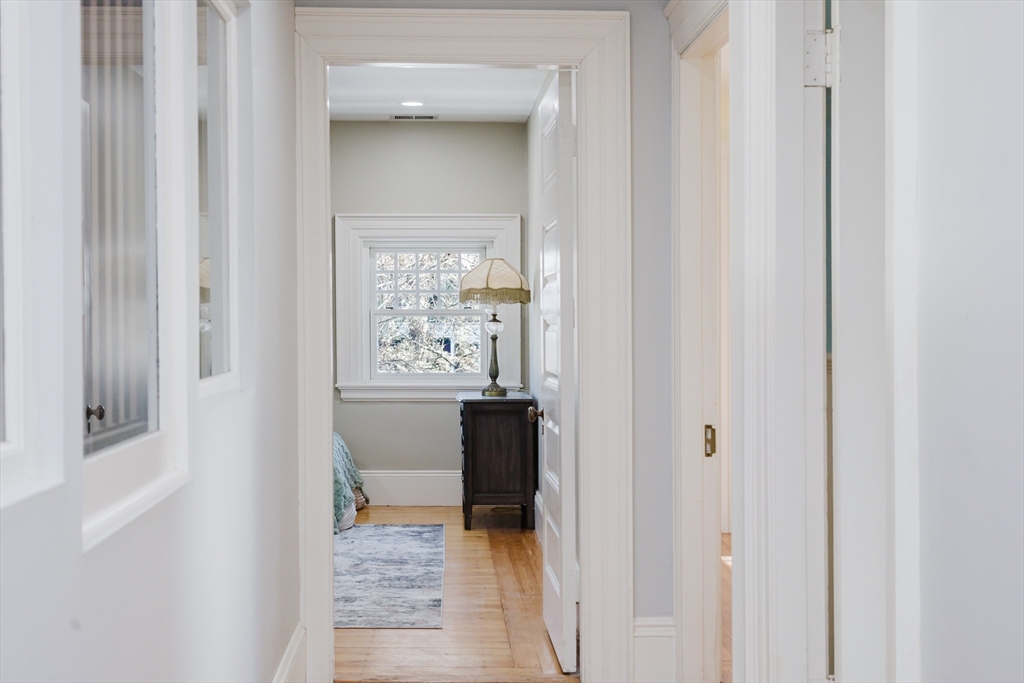 159 Washington Street, Unit 4 Newton, MA 02458 - Photo 29 of 41 a view of a bathroom from a hallway