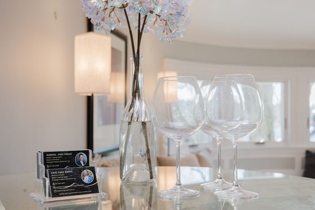 159 Washington Street, Unit 4 Newton, MA 02458 - Photo 31 of 42 a vase of flowers sitting on a table