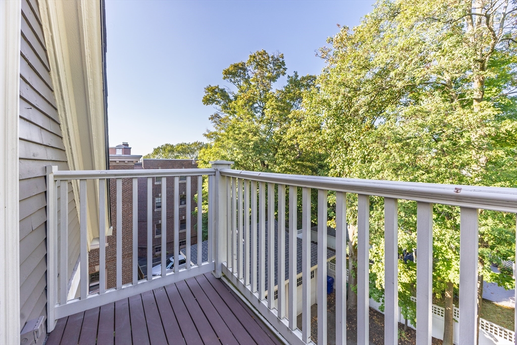 159 Washington Street, Unit 4 Newton, MA 02458 - Photo 33 of 42 a view of a balcony with wooden floor