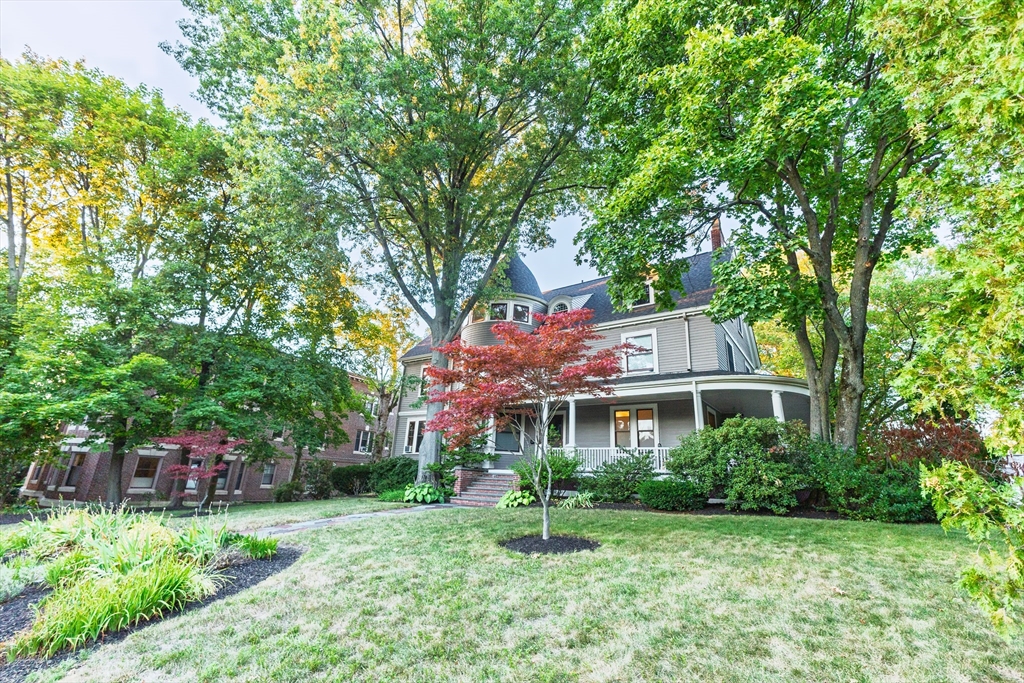 159 Washington Street, Unit 4 Newton, MA 02458 - Photo 36 of 41 a front view of a house with a yard