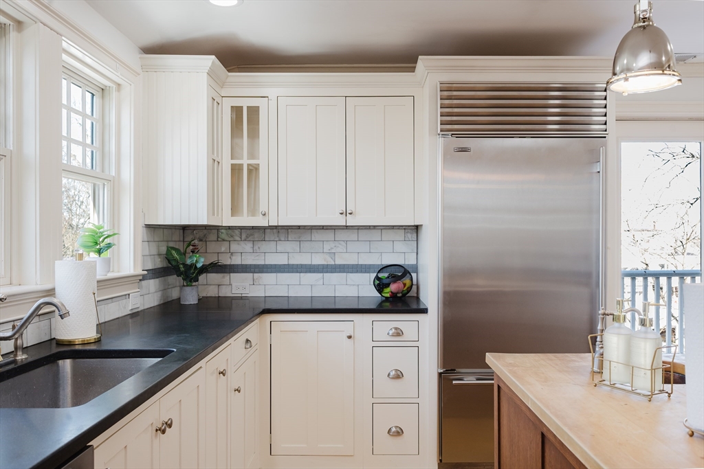 159 Washington Street, Unit 4 Newton, MA 02458 - Photo 36 of 42 a kitchen with a sink and cabinets