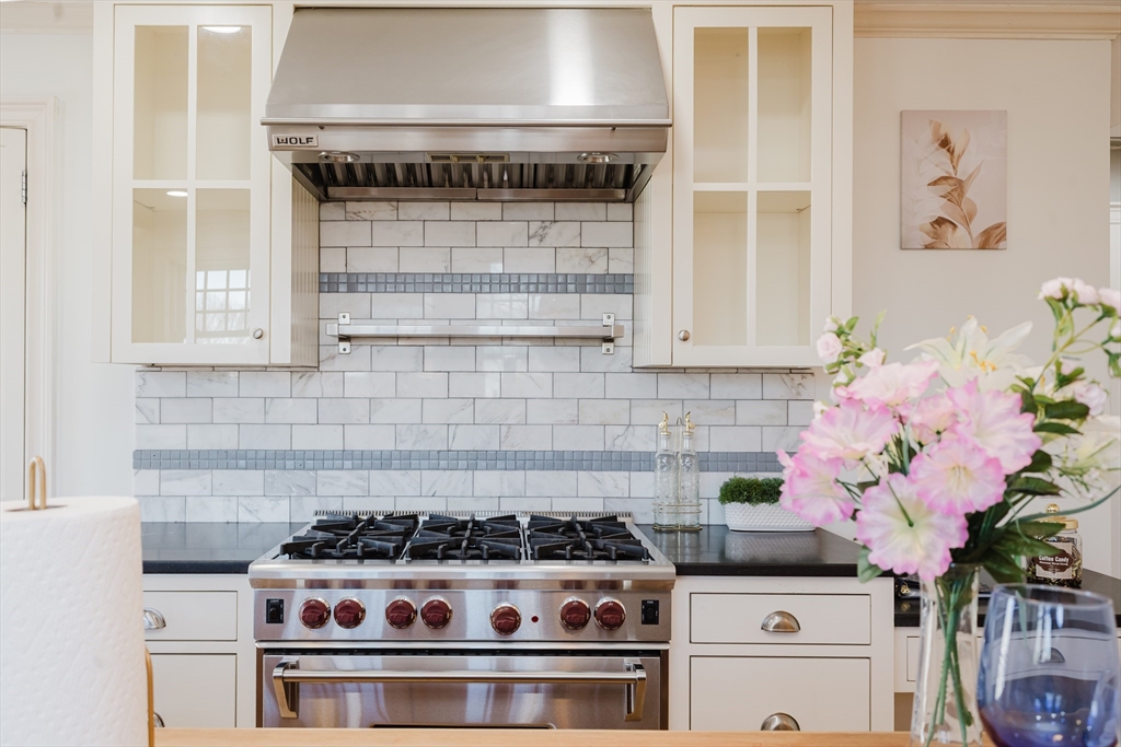 159 Washington Street, Unit 4 Newton, MA 02458 - Photo 38 of 41 a kitchen with a stove and cabinets