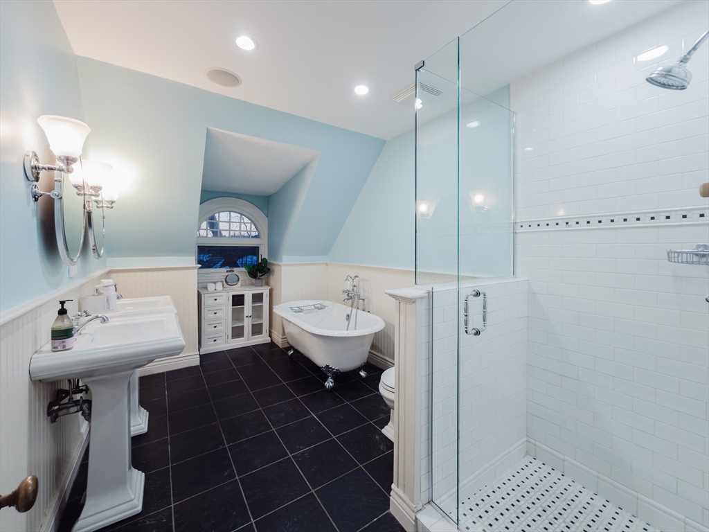 159 Washington Street, Unit 4 Newton, MA 02458 - Photo 40 of 42 a bathroom with a sink toilet and shower