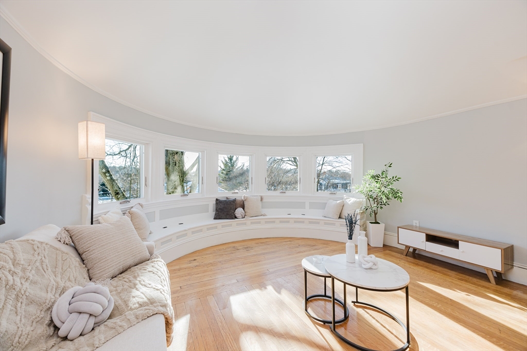 159 Washington Street, Unit 4 Newton, MA 02458 - Photo 8 of 41 a living room with furniture and a large window