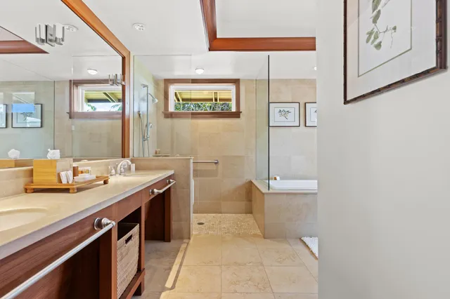 a bathroom with a granite countertop sink a toilet and mirror