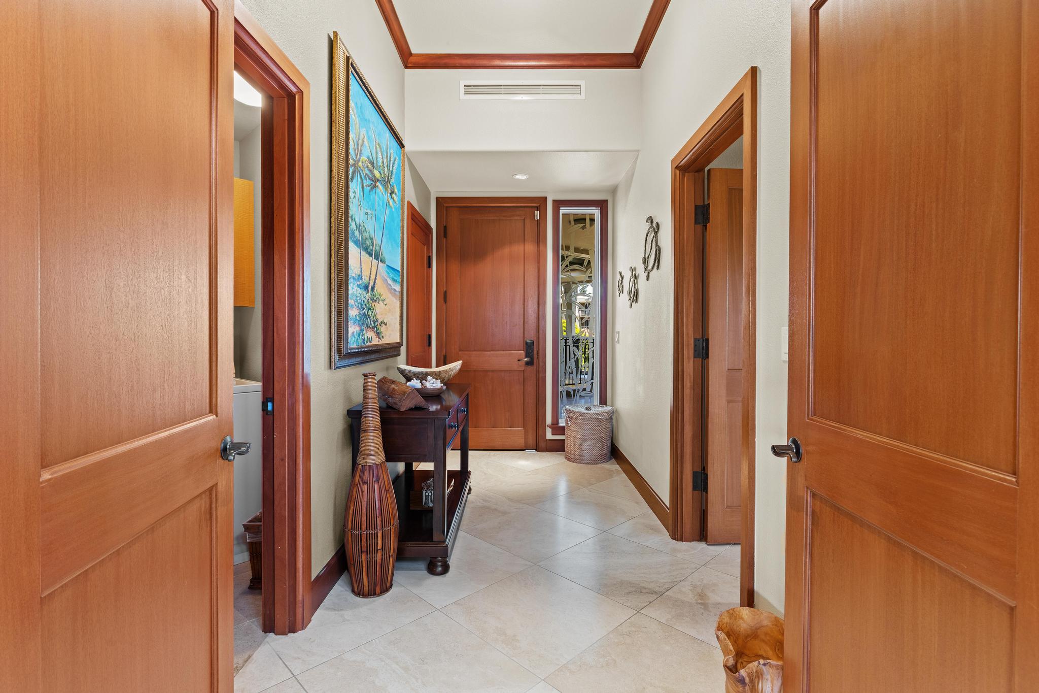 69-1000 Kolea Kai Circle, Unit 11C Waikoloa, HI 96738 - Photo 20 of 30 a view of a hallway with furniture and a window