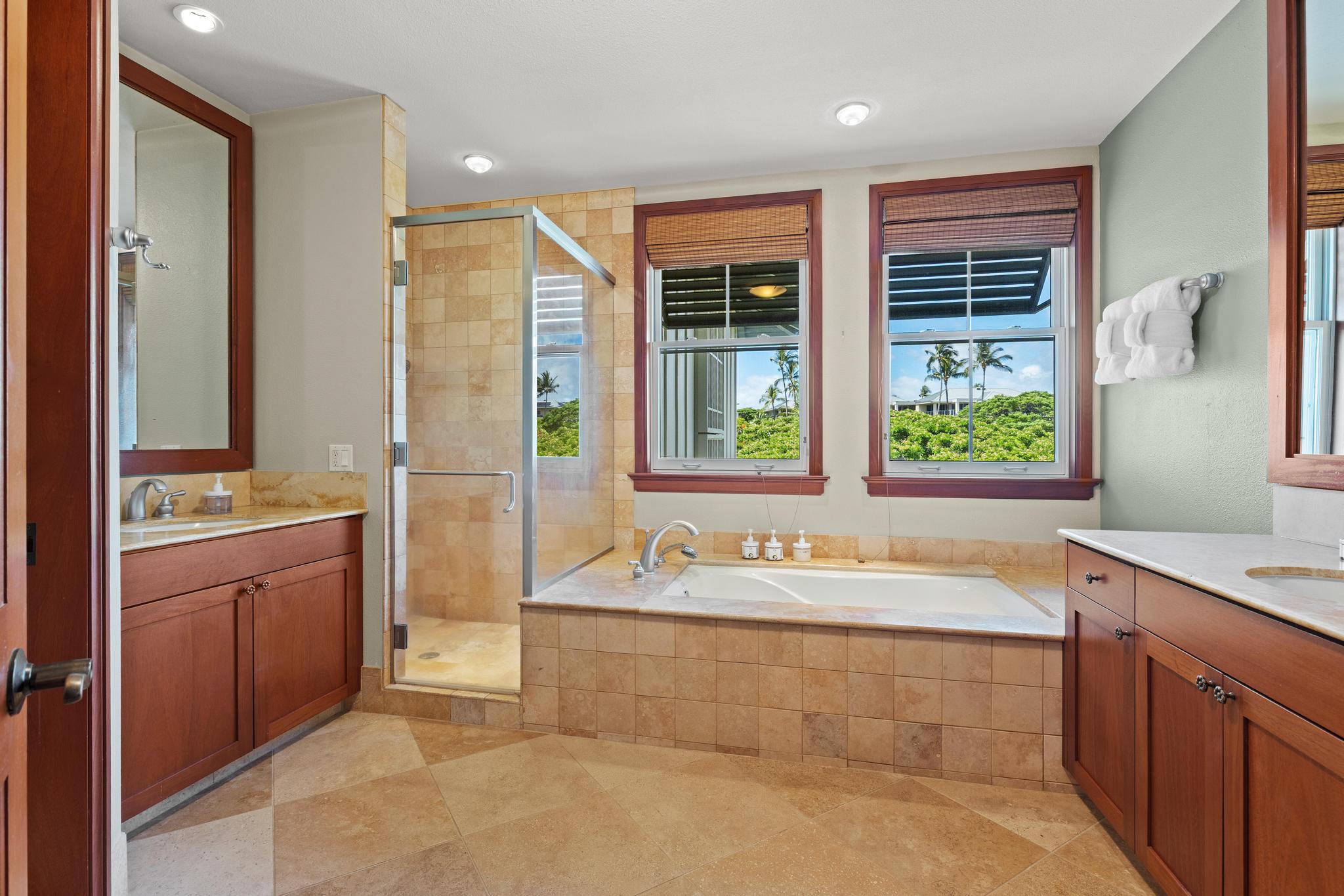 69-1000 Kolea Kai Circle, Unit 11C Waikoloa, HI 96738 - Photo 22 of 30 a bathroom with a tub sink and mirror