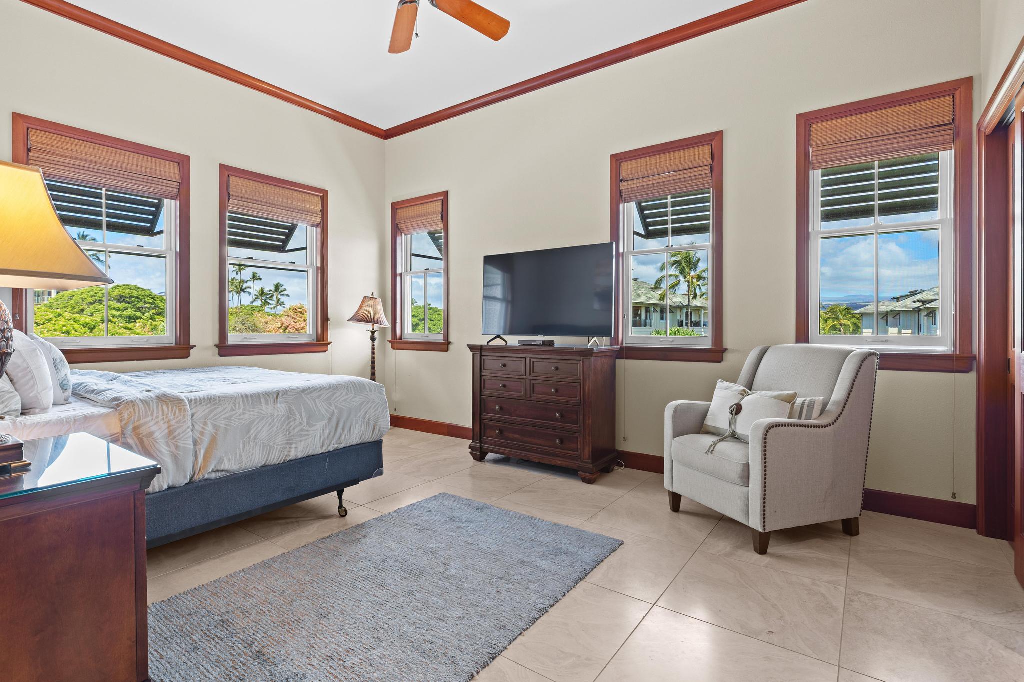 69-1000 Kolea Kai Circle, Unit 11C Waikoloa, HI 96738 - Photo 23 of 30 a living room with furniture and a flat screen tv