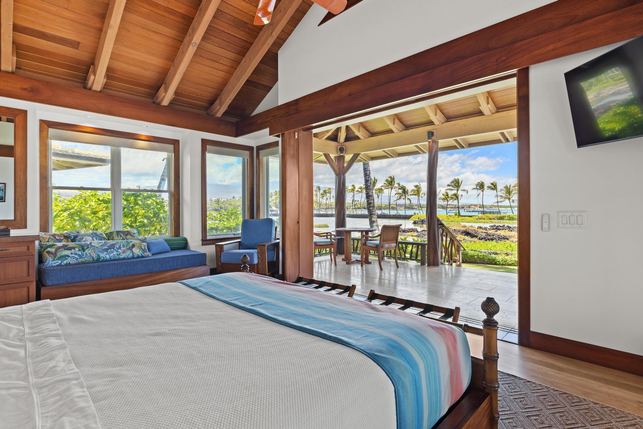 69-1000 Kolea Kai Circle, Unit 11C Waikoloa, HI 96738 - Photo 25 of 30 a bed sitting in a bedroom next to a window