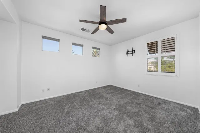 a view of room with ceiling fan